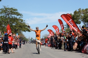 Steele von Hoff crossing the finish line in the Tour de Timor